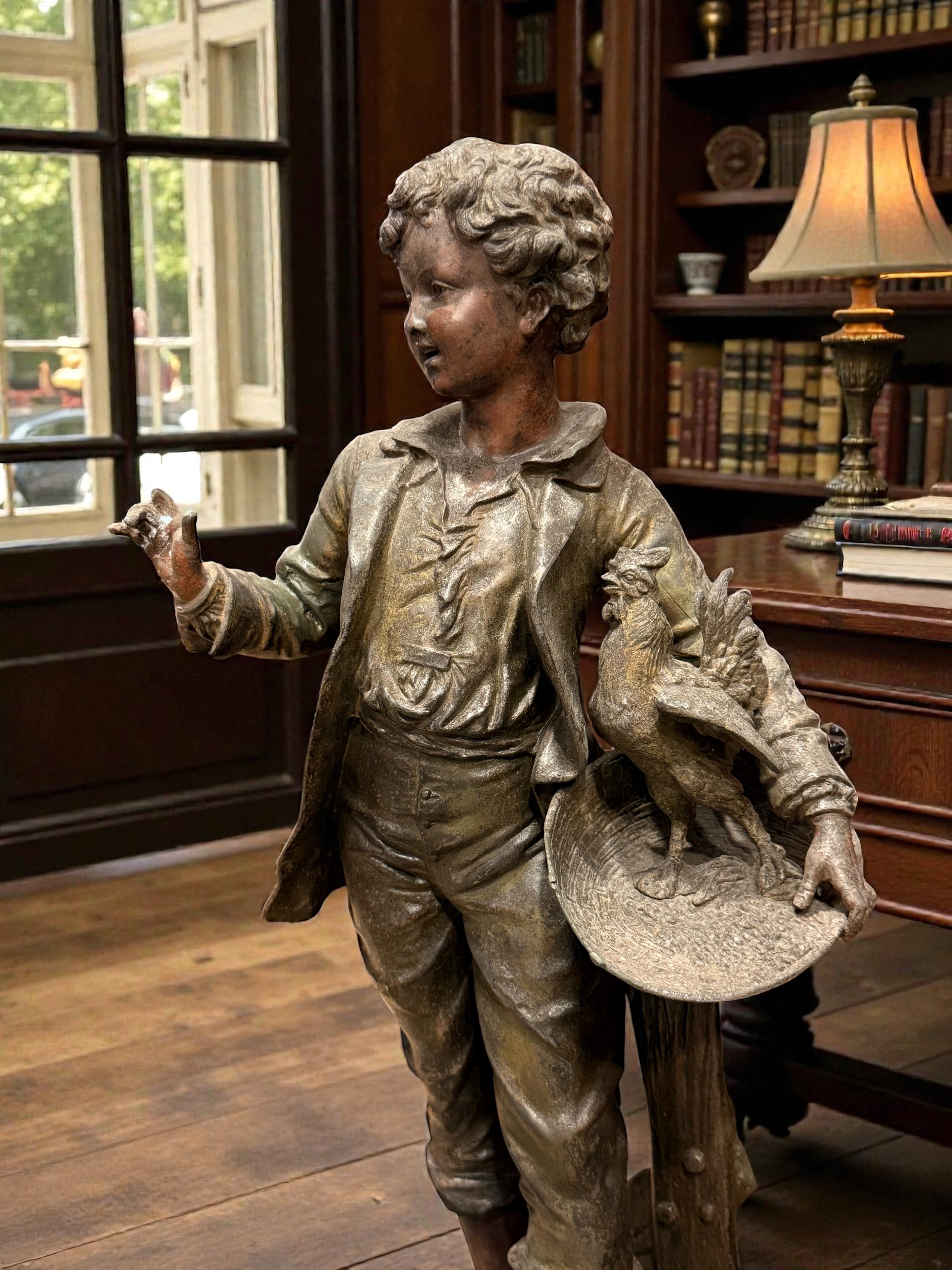 French Belle Époque Statue Lamp with Clock

Émile Bruchon – “Boy Holding a Nest”
