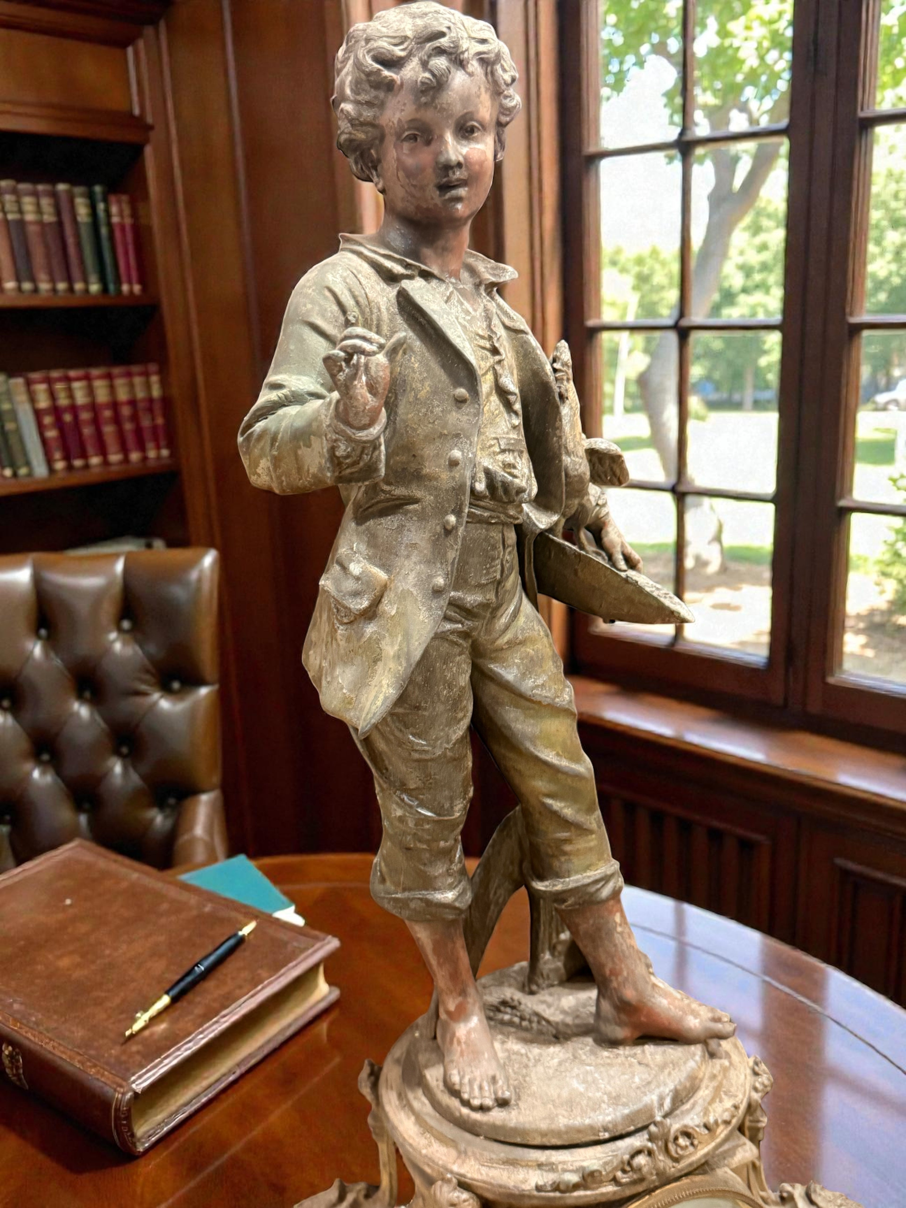 French Belle Époque Statue Lamp with Clock

Émile Bruchon – “Boy Holding a Nest”